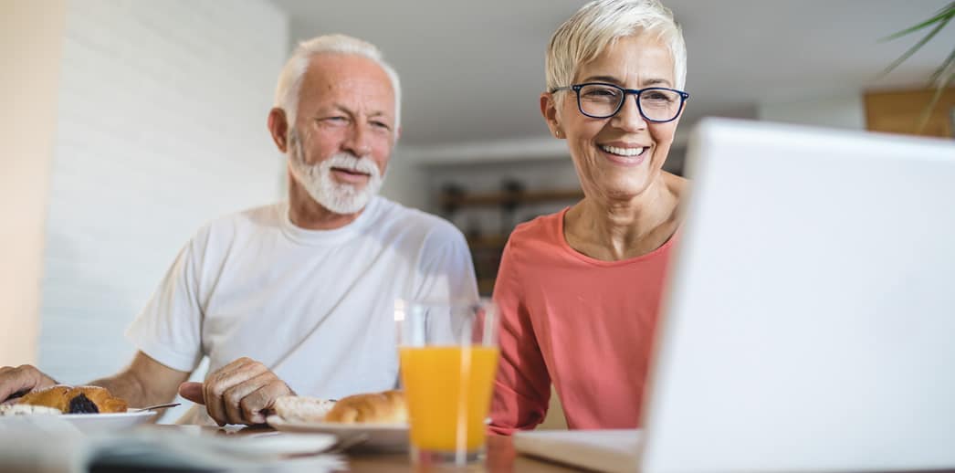 Couple comparing Medicare plans online